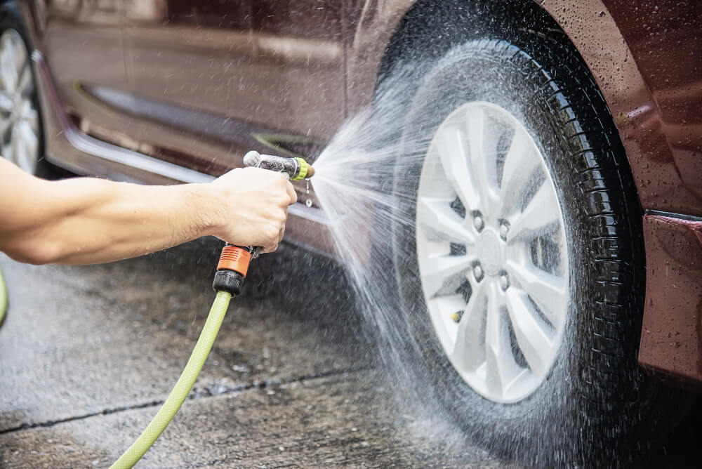 man-washing-car-using-shampoo-water